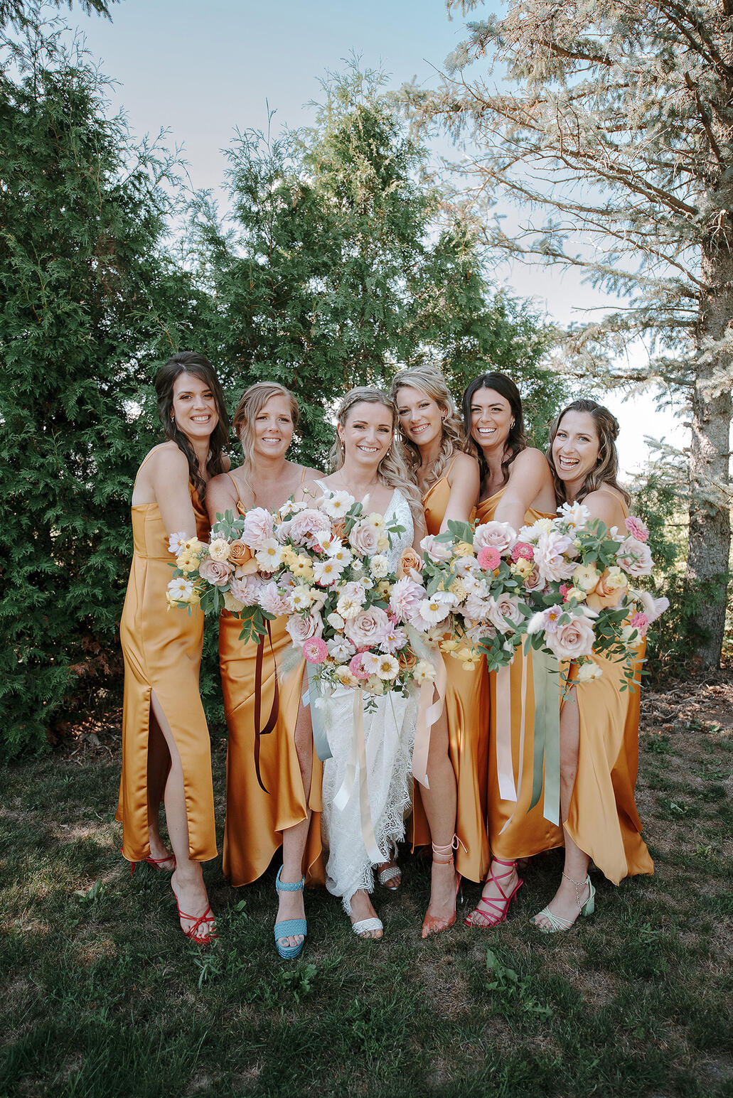 Bride and her bridesmaid holding their bouquet.